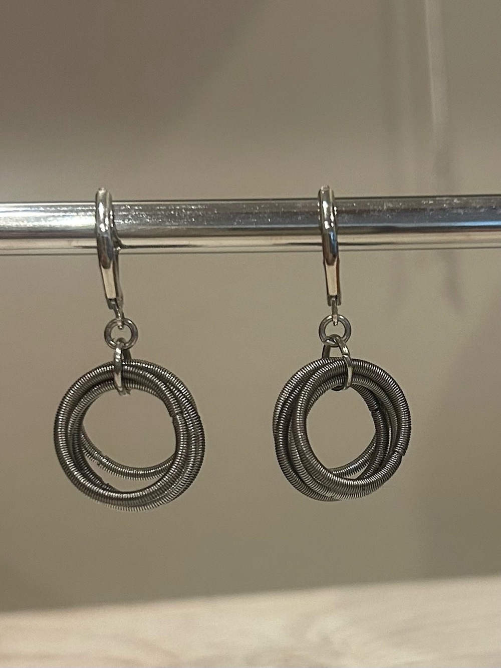 Piano Wire Hoop Earrings, Silver Tone
New, Never Worn